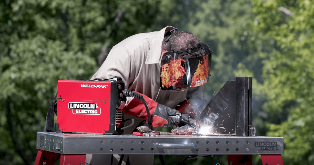 Person welding outdoors